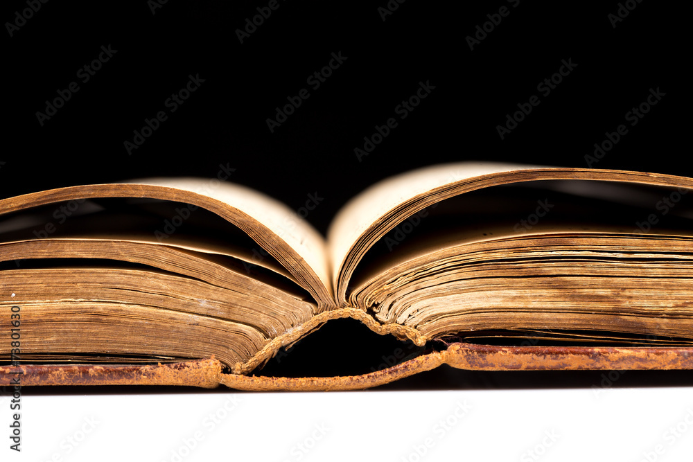 Fototapeta premium ancient book shot on black background