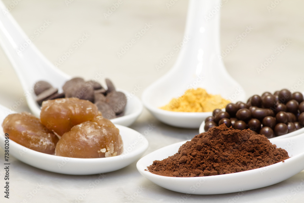 cocoa powder, chocolate pralineand drop, marron glacee and gold cocoa powder, chocolate pralineand drop, marron glacee and gold