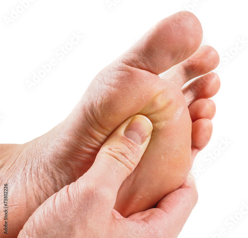 Male person receiving podiatry with pressure point technique und