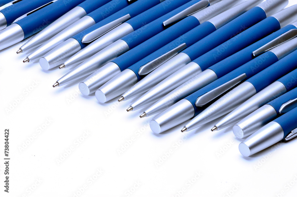 Silver-blue metal pens isolated on white background. Silver-blue metal pens isolated on white background.
