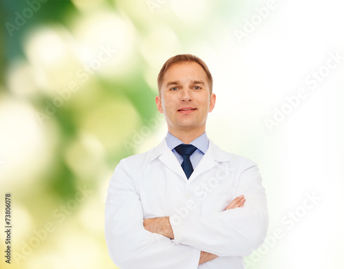 smiling male doctor in white coat