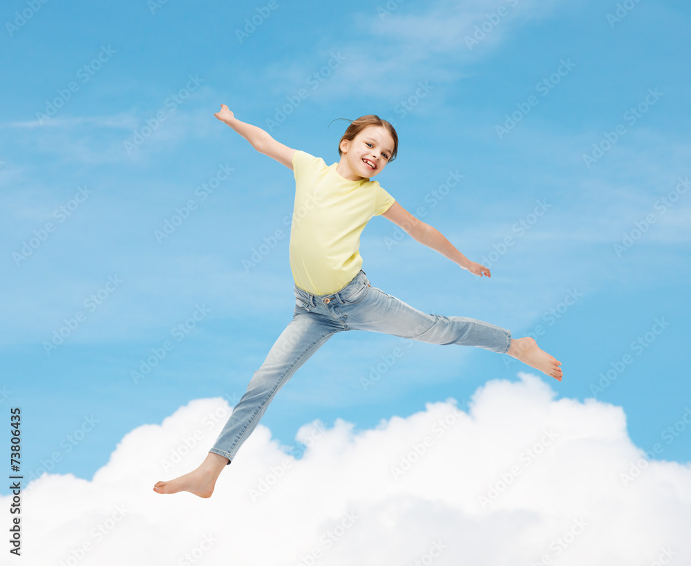 smiling little girl jumping smiling little girl jumping