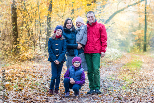 Photo of happy family looking at camera outdoors © bubutu