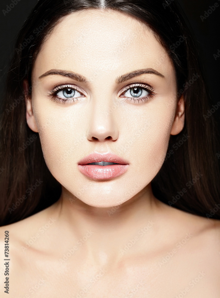 sensual beautiful model with nude makeup on blue background sensual beautiful model with nude makeup on blue background
