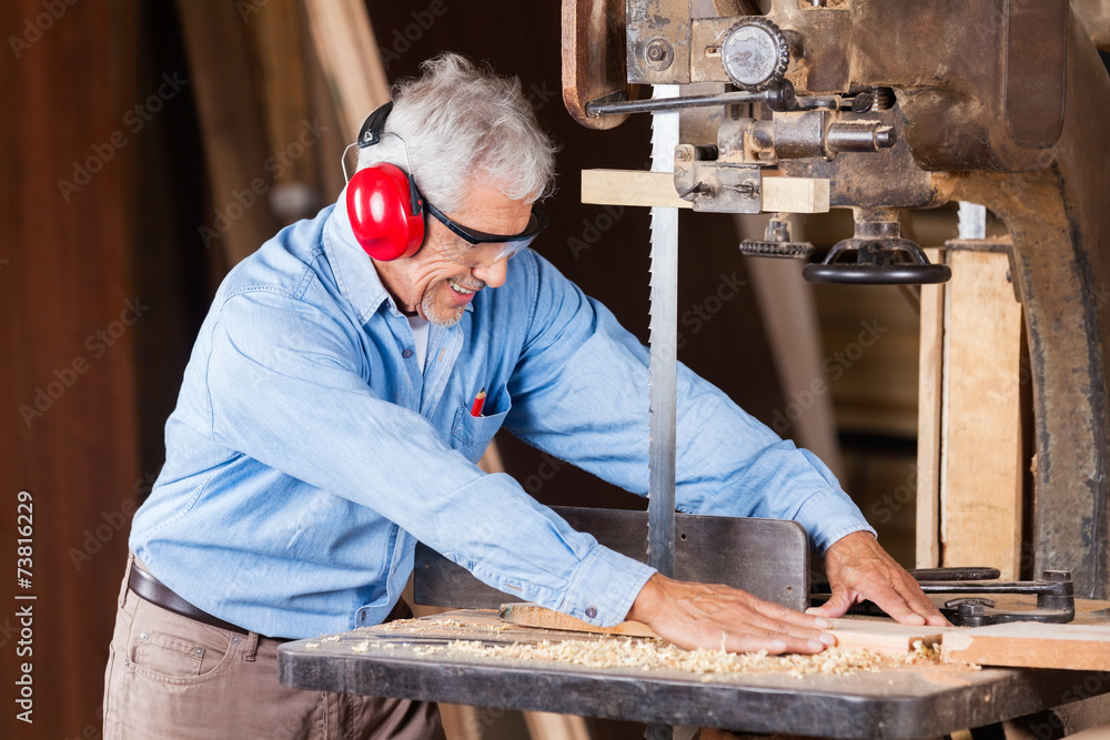 Carpenter Cutting Wood With Bandsaw Carpenter Cutting Wood With Bandsaw