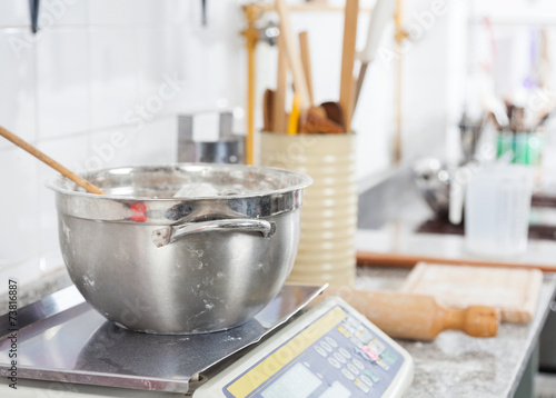 Mixing Bowl On Weight Scale In Commercial Kitchen