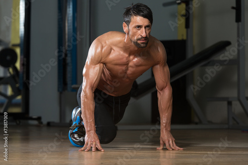 Strong Muscular Men Kneeling On The Floor