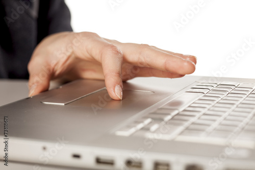 Ladies fingers to the touch pad of the laptop