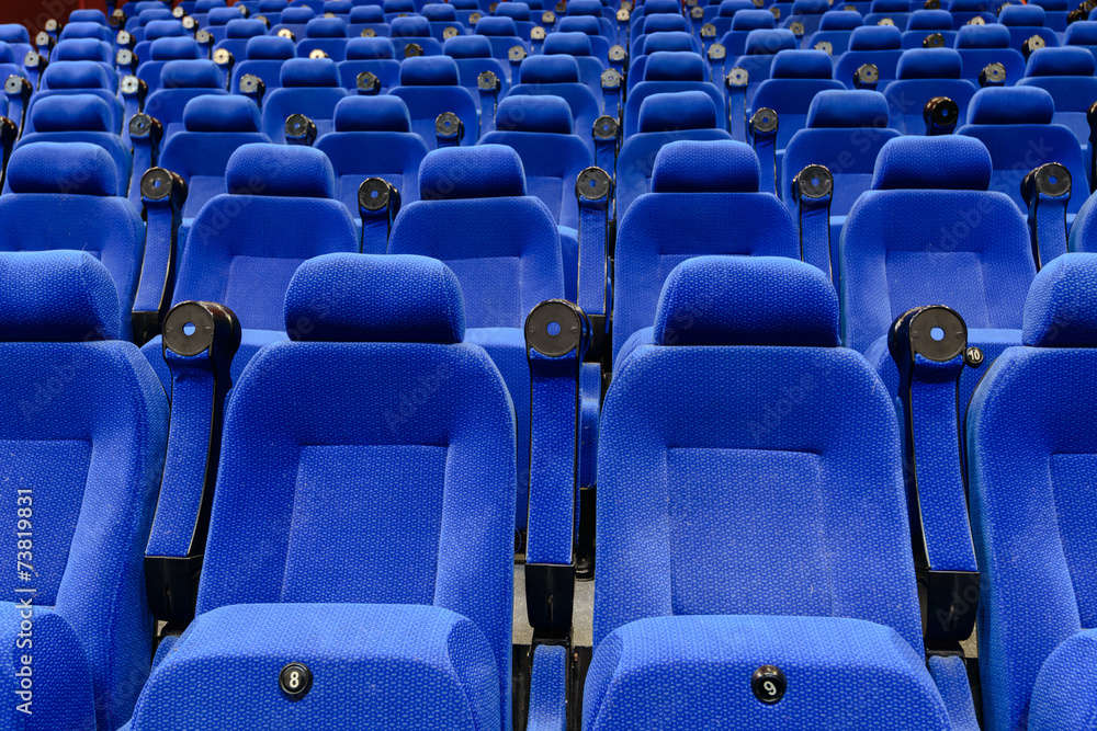 Naklejka premium Empty movie theater with red seats