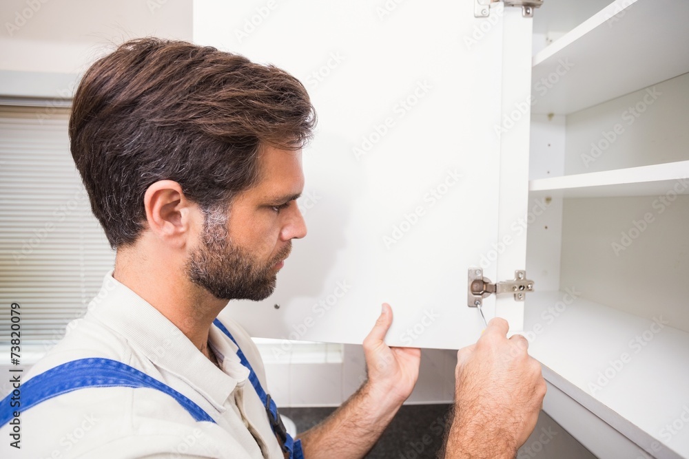 Handyman putting up a shelf