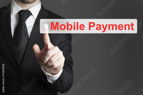 businessman pushing flat button mobile payment