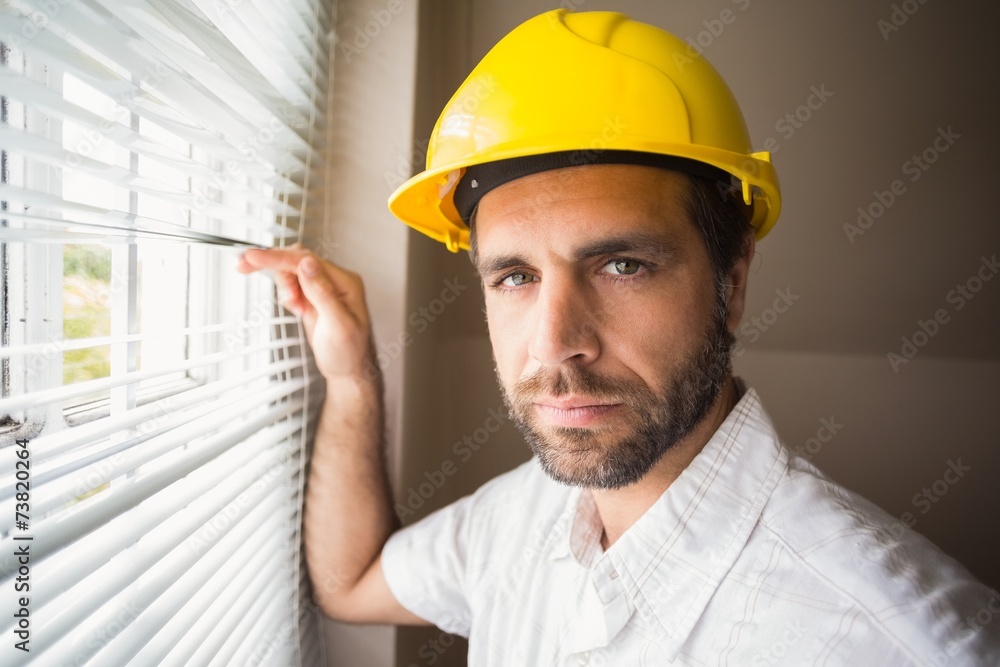 Handyman looking out the window Handyman looking out the window