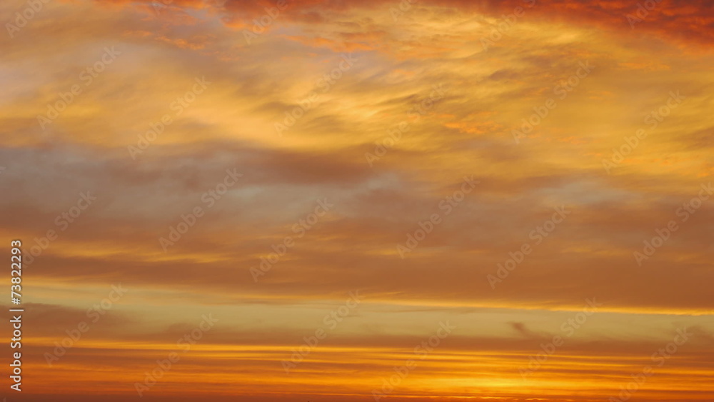 Time lapse shot of the morning sunrise through the clouds Time lapse shot of the morning sunrise through the clouds