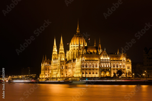 Budapest Parliament at night with reflection in Danube river © castenoid