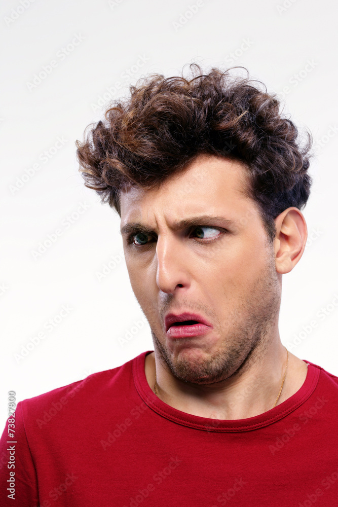 Young man with displeased facial expression Young man with displeased facial expression