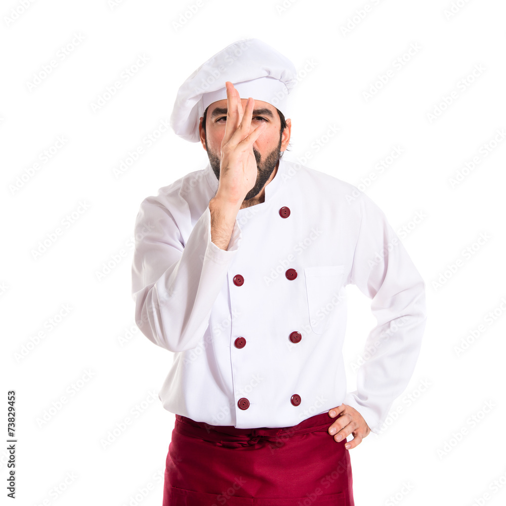 Chef making a joke over white background Chef making a joke over white background