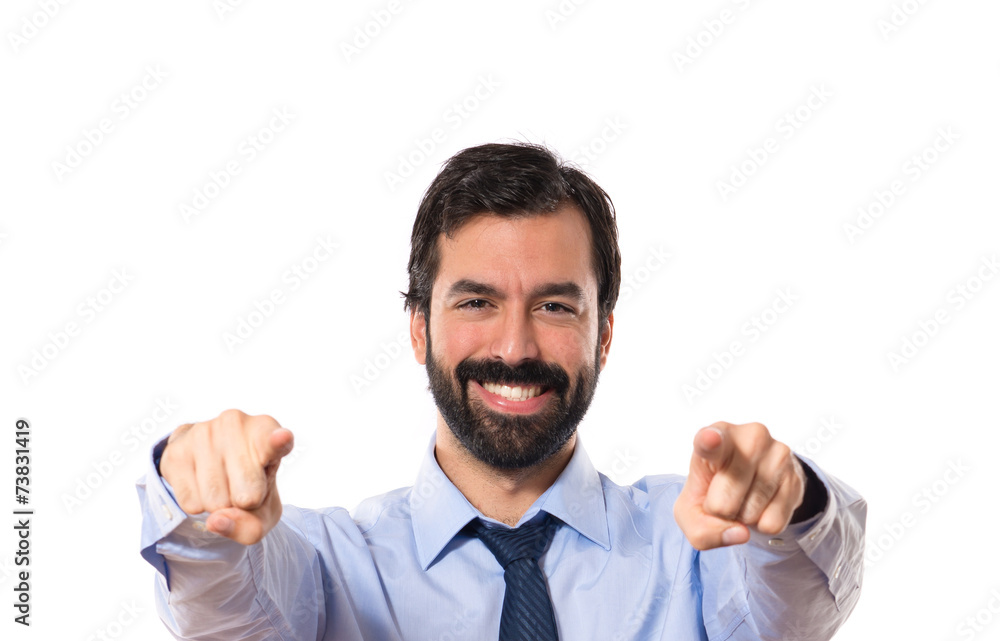 Businessman pointing to the front over white background Businessman pointing to the front over white background