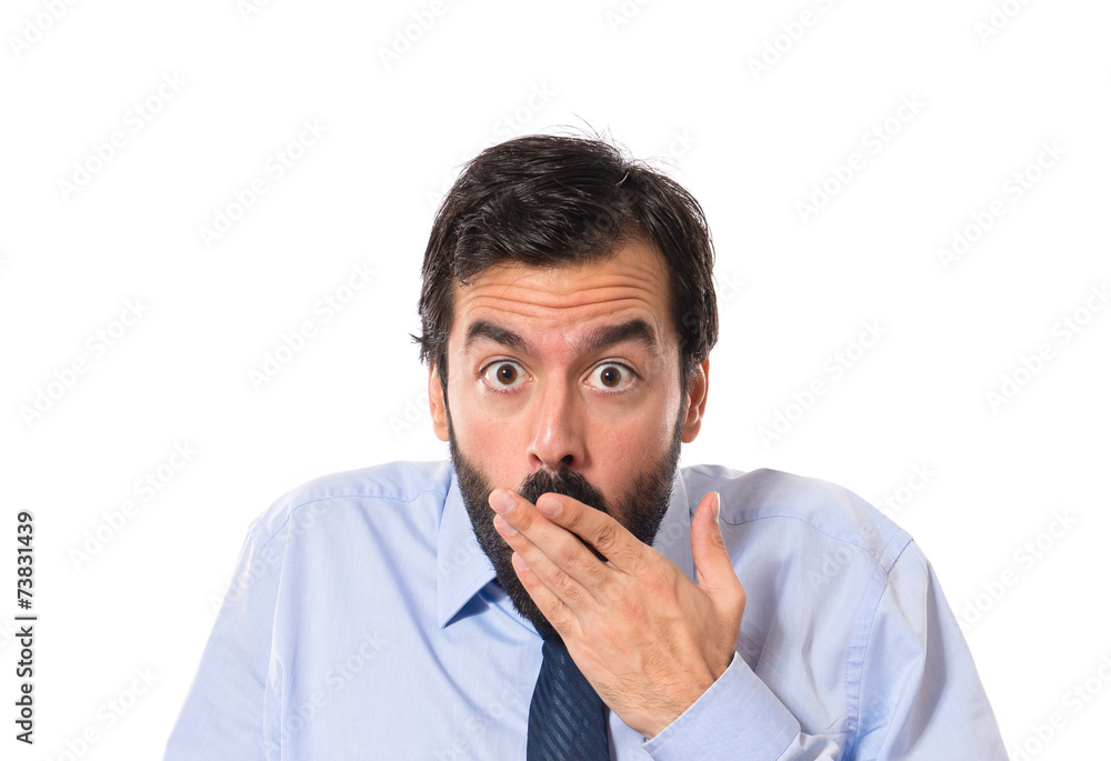 Businessman doing surprise gesture over white background