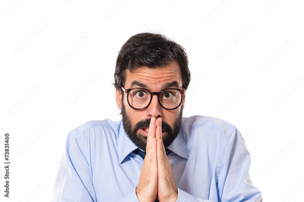 Businessman pleading over white background Businessman pleading over white background