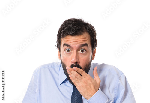 Businessman doing surprise gesture over white background