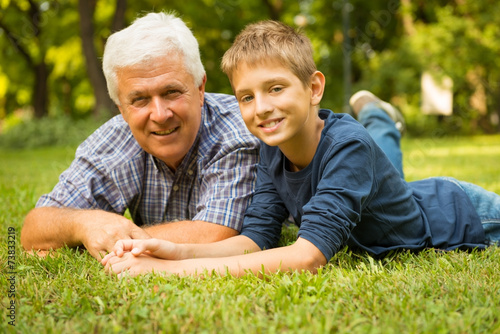 Grandfather and grandson in the park © Stock Rocket
