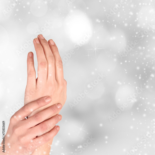 Woman hand on Christmas background