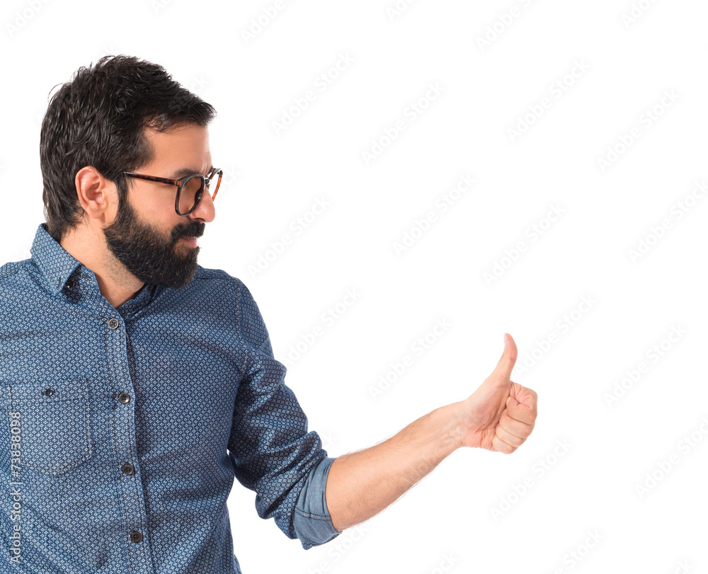 Young hipster man with thumb up Young hipster man with thumb up