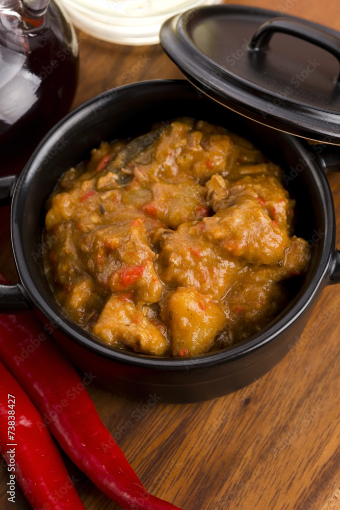homemade hot goulash on wooden table homemade hot goulash on wooden table
