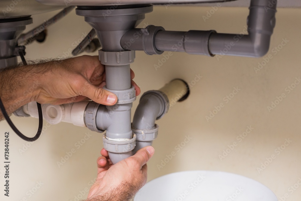 Plumber fixing under the sink Plumber fixing under the sink
