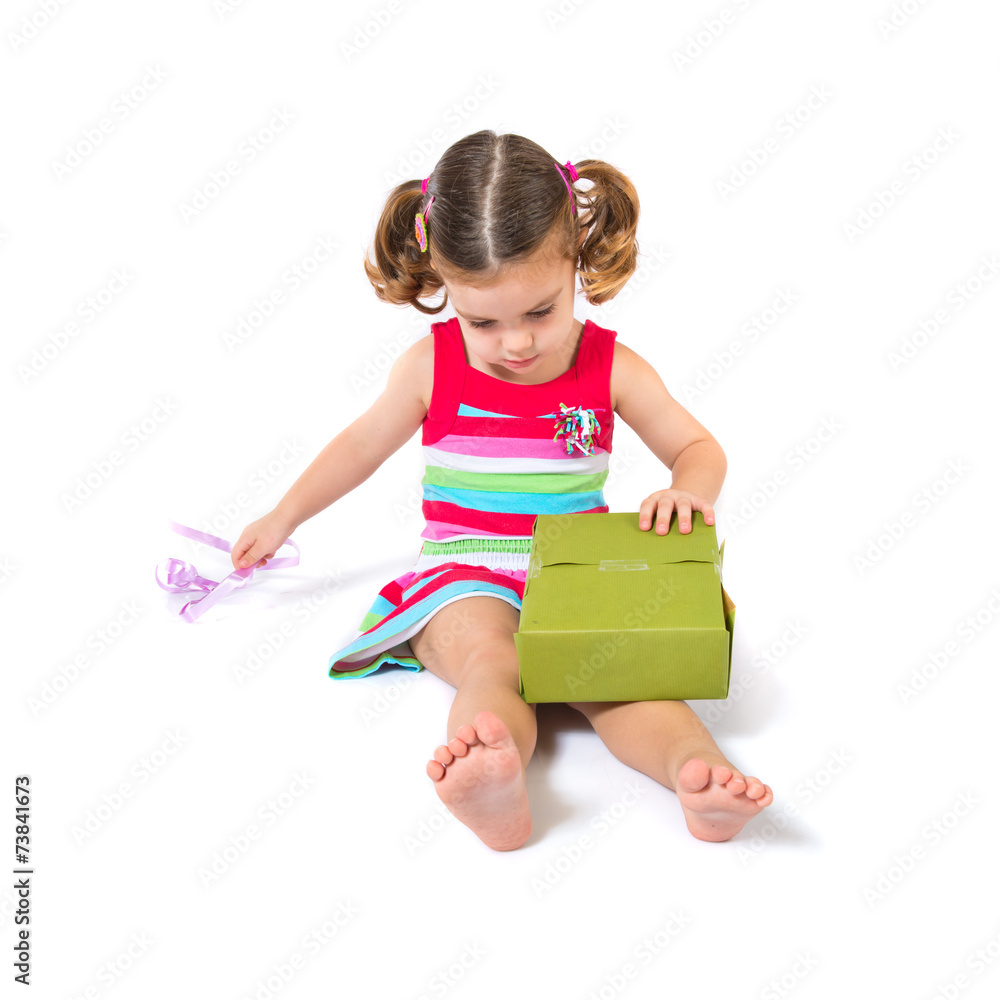 Kid holding a present over white background Kid holding a present over white background