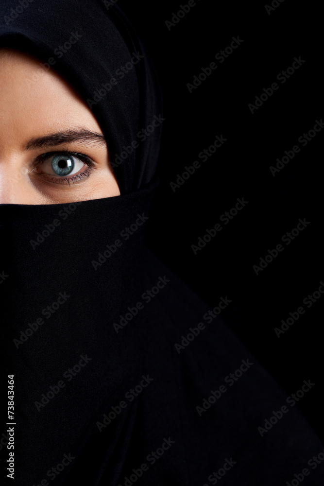 Naklejka premium Muslim woman wearing black veil