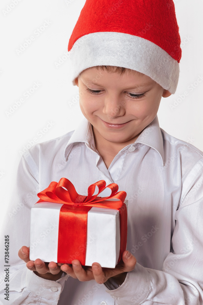 smiling boy with christmas gift box. smiling boy with christmas gift box.