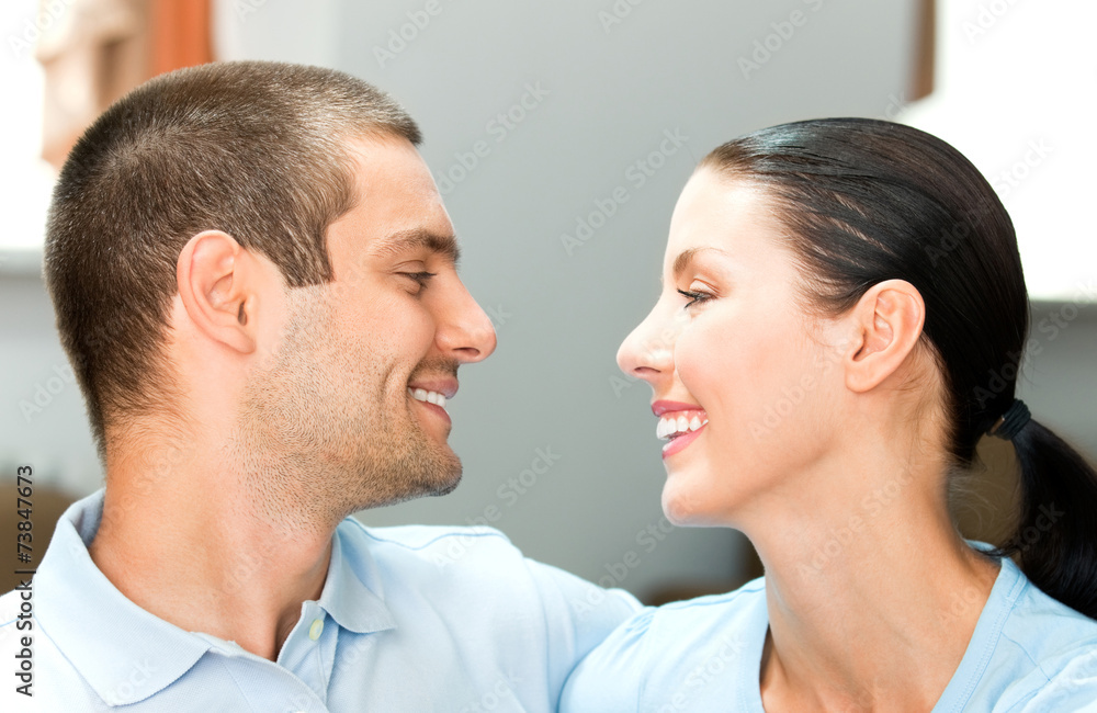 Young happy smiling attractive couple at home Young happy smiling attractive couple at home