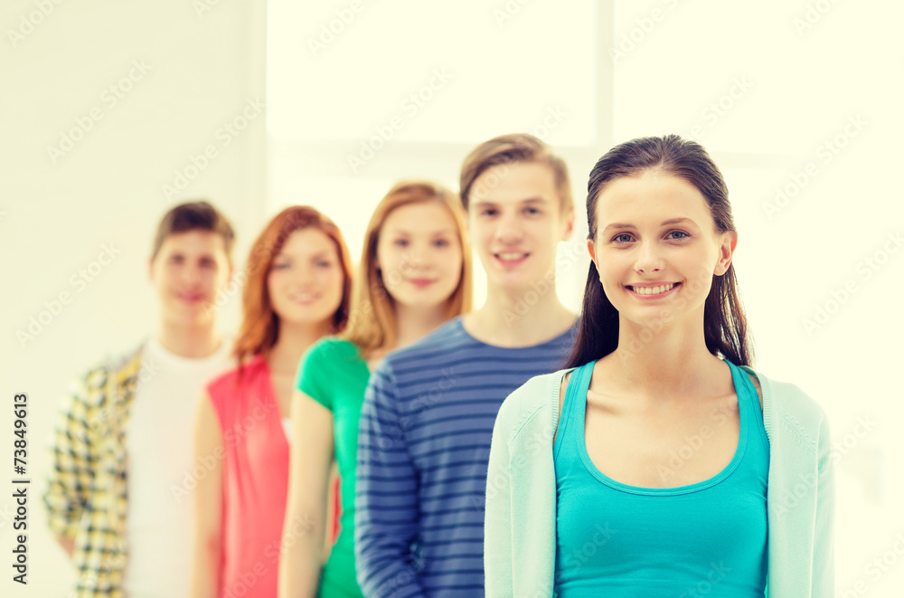smiling students with teenage girl in front smiling students with teenage girl in front
