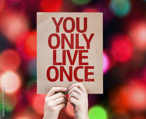 You Only Live Once written on colorful background photo