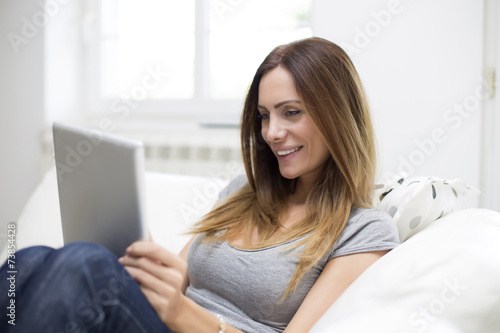 Young woman with tablet at ...