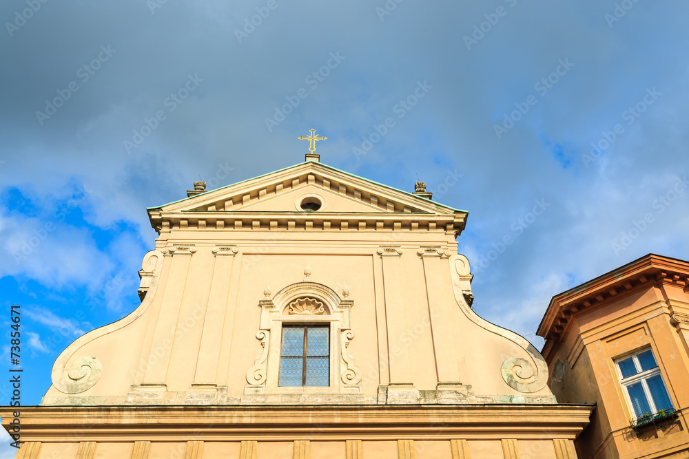 Front facade of old church on Grodzka street in Krakow, Poland