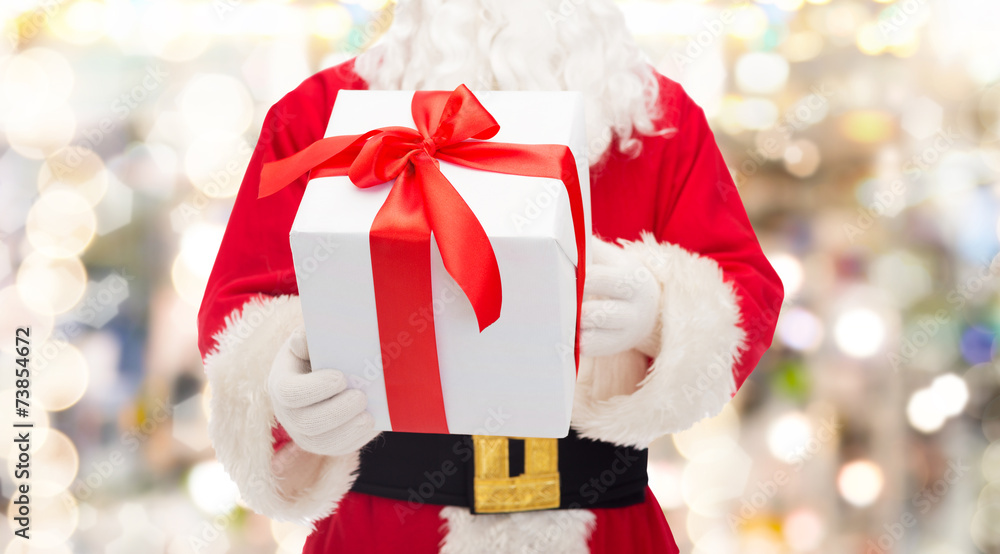 man in costume of santa claus with gift box man in costume of santa claus with gift box