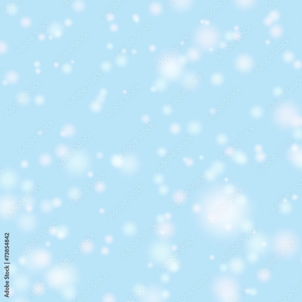 Blurred bokeh christmas background with falling white  snowflake