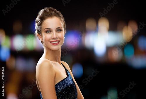 smiling woman in evening dress © Syda Productions