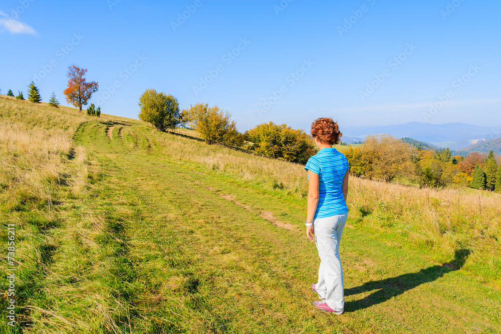 Young woman tourist on path in Pieniny Mountains. Poland