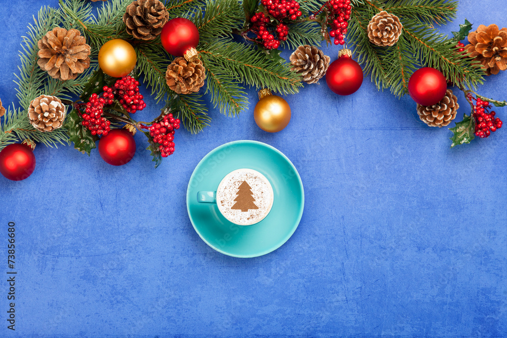 cappuccino and christmas tree shape and pine branch on blue back cappuccino and christmas tree shape and pine branch on blue back