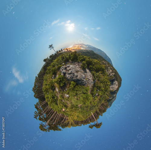 Little planet panorama at night with clouds and city light