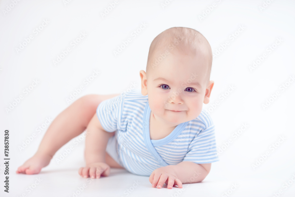 Baby lying on the white floor