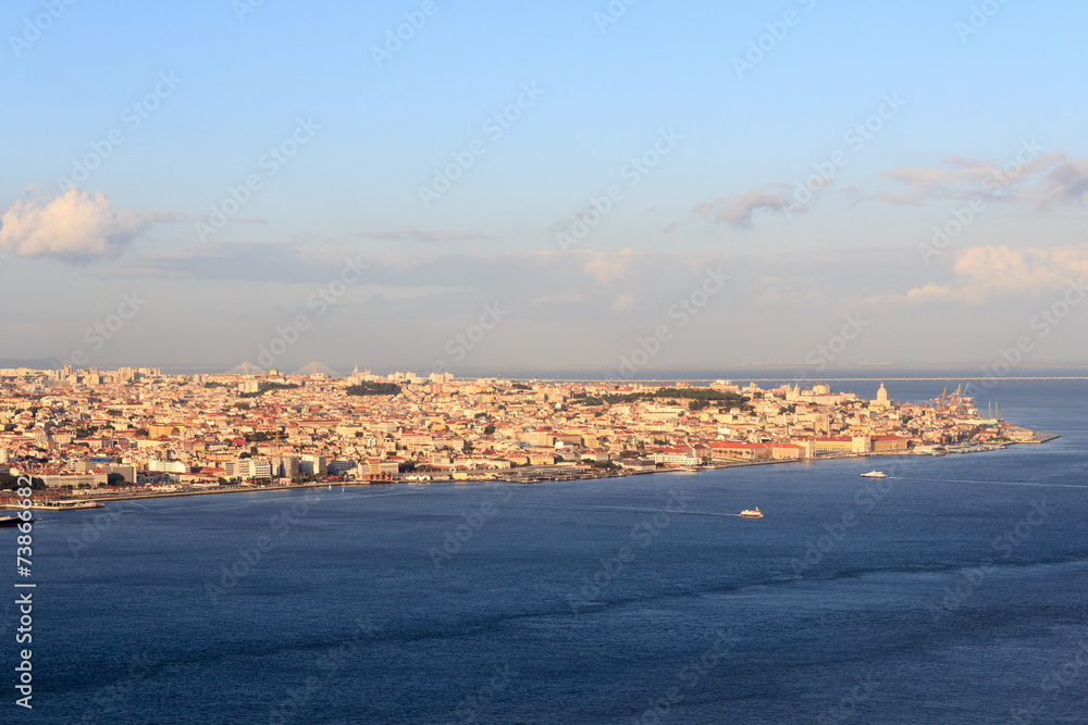 View across river Tagus towards historic city of Lisbon
