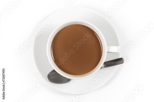 Cup of coffee with milk with spoon on white background, top view