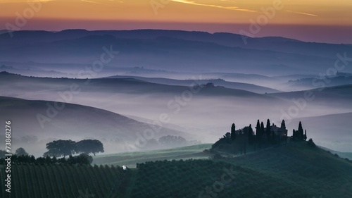 Sunrise over foggy valley in Tuscany 4k timelapse photo