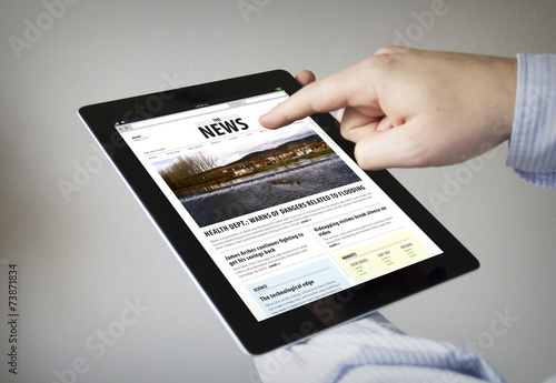reading news on a tablet