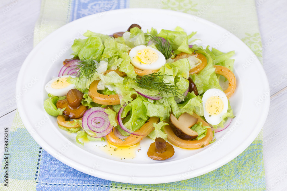 Fresh salad with mushrooms, squid and quail eggs Fresh salad with mushrooms, squid and quail eggs
