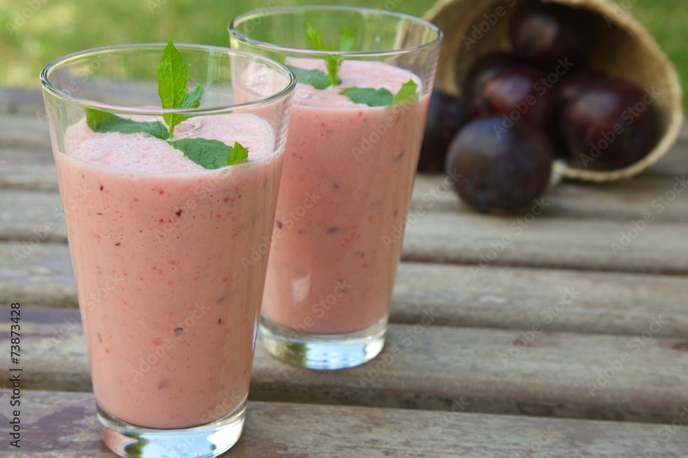 Two glasses of plum smoothie
